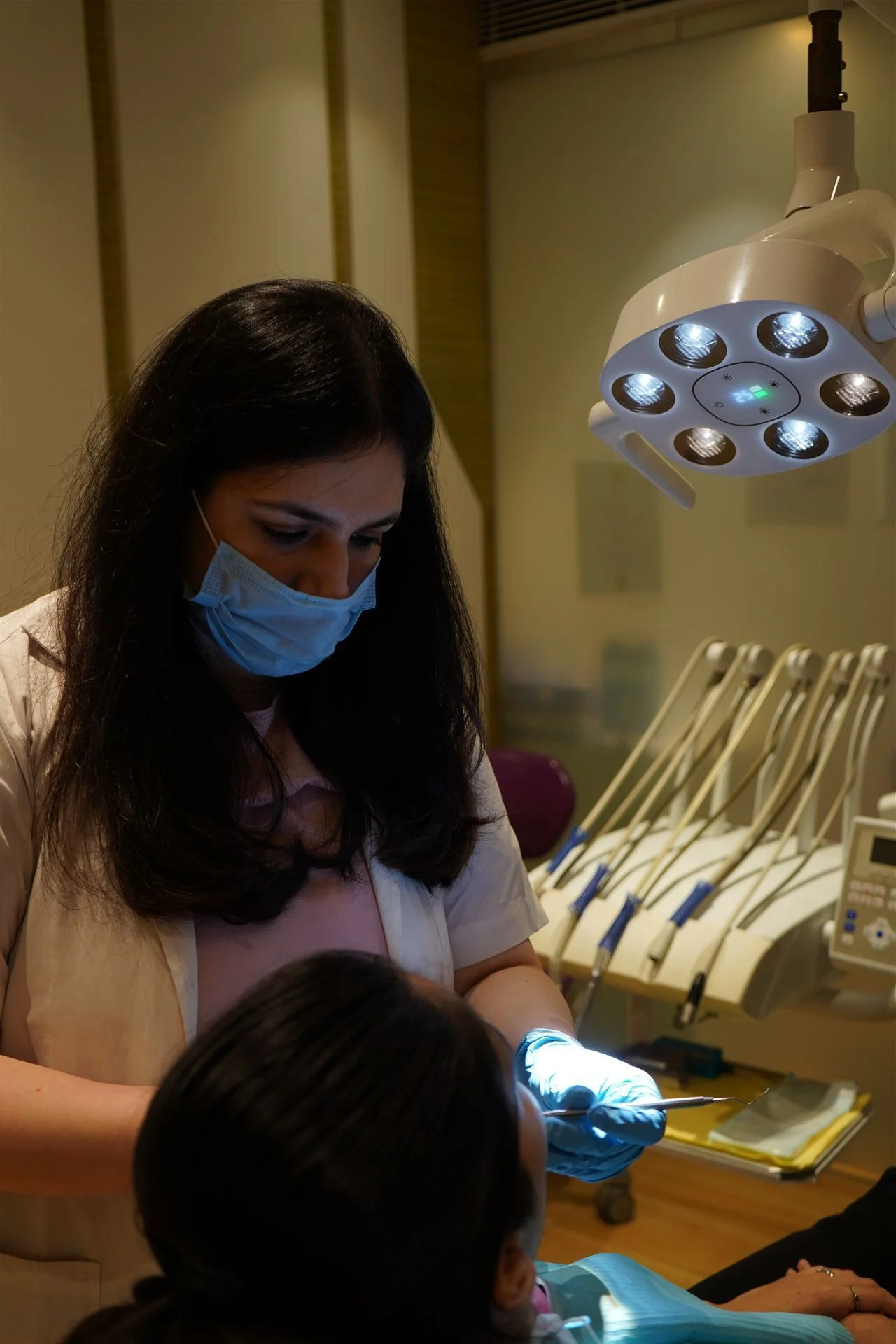 Dr. Shruti Malik performing dental treatment at Radix Cosmo Dental, Nirman Vihar, East Delhi